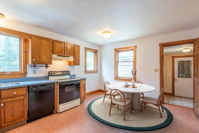 418 Buzzell Hill Rd, Hope, ME 04847 - kitchen with black dishwasher, electric stove, under cabinet range hood, and brown cabinetry
