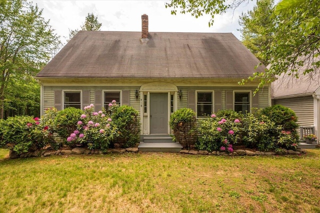 418 Buzzell Hill Rd, Hope, ME 04847 - cape cod house with a front yard and a chimney