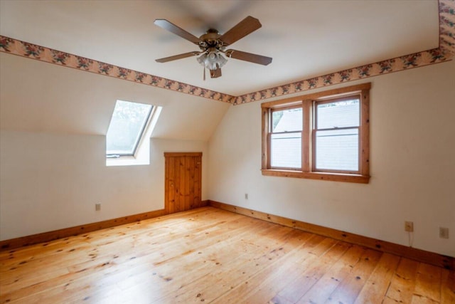 418 Buzzell Hill Rd, Hope, ME 04847 - additional living space with a skylight, light wood-style floors, vaulted ceiling, and ceiling fan