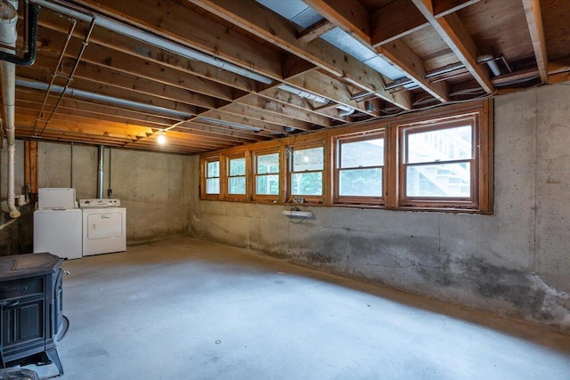 418 Buzzell Hill Rd, Hope, ME 04847 - below grade area featuring separate washer and dryer and a wood stove