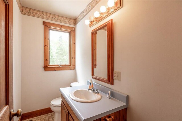 418 Buzzell Hill Rd, Hope, ME 04847 - bathroom featuring toilet and vanity