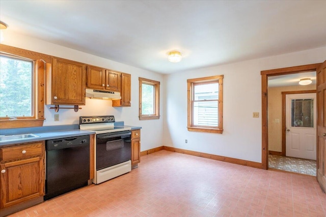 418 Buzzell Hill Rd, Hope, ME 04847 - kitchen featuring dishwasher, electric range, under cabinet range hood, and brown cabinetry