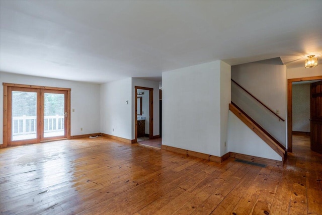 418 Buzzell Hill Rd, Hope, ME 04847 - empty room with light wood-style floors and stairway