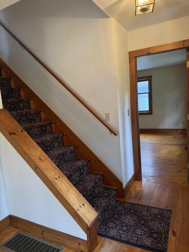 418 Buzzell Hill Rd, Hope, ME 04847 - staircase featuring hardwood / wood-style flooring and baseboards