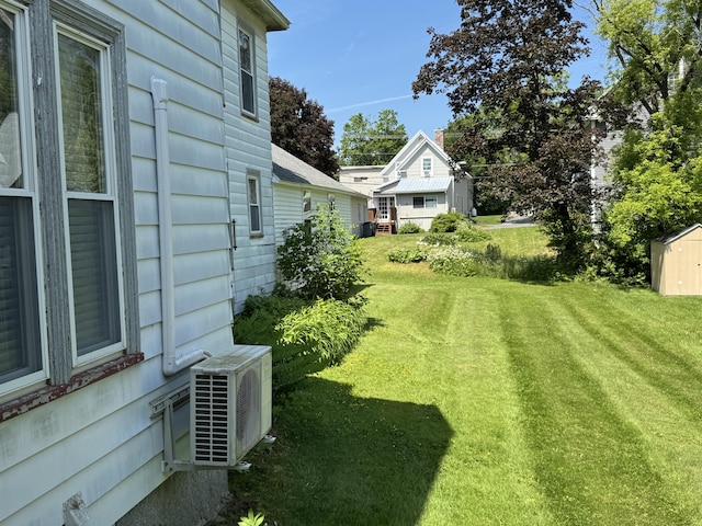 164 Lancey St, Pittsfield, ME 04967 - view of green lawn featuring a shed