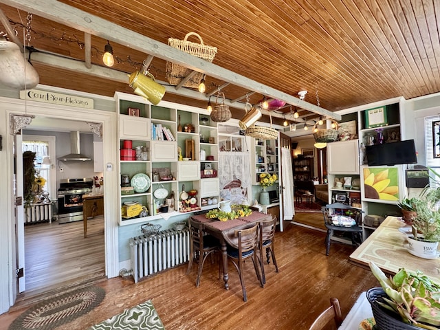 164 Lancey St, Pittsfield, ME 04967 - dining space with radiator heating unit, a wood ceiling with exposed beams, wood finished floors, and a chandelier