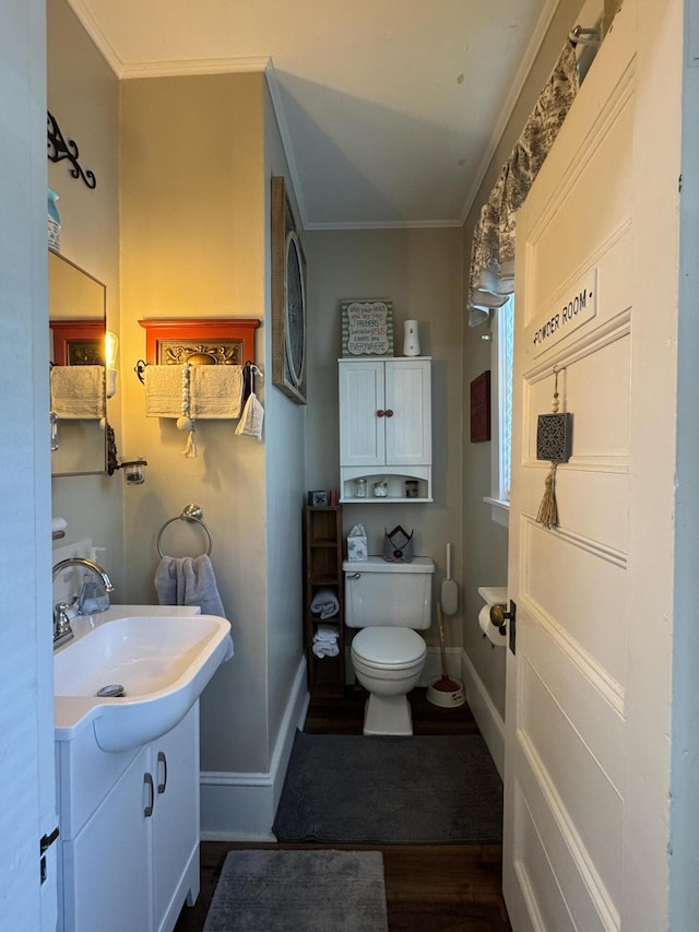 164 Lancey St, Pittsfield, ME 04967 - bathroom with crown molding, vanity, and wood finished floors