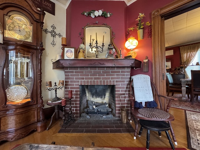 164 Lancey St, Pittsfield, ME 04967 - sitting room featuring wood finished floors, ornamental molding, and a fireplace