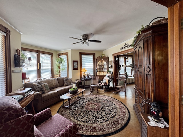164 Lancey St, Pittsfield, ME 04967 - living area with ceiling fan, light wood-type flooring, and crown molding