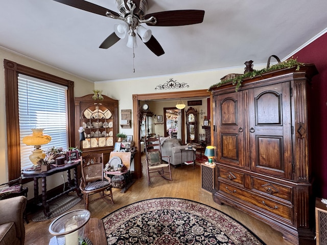 164 Lancey St, Pittsfield, ME 04967 - sitting room with wood finished floors, a ceiling fan, and ornamental molding