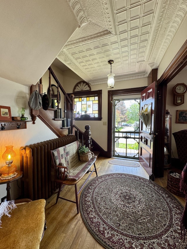 164 Lancey St, Pittsfield, ME 04967 - entrance foyer featuring wood finished floors, stairs, and an ornate ceiling