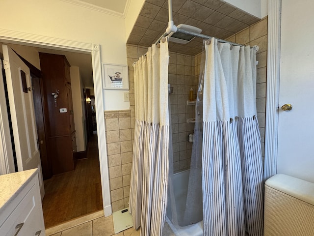 164 Lancey St, Pittsfield, ME 04967 - full bath with vanity, ornamental molding, and tile walls