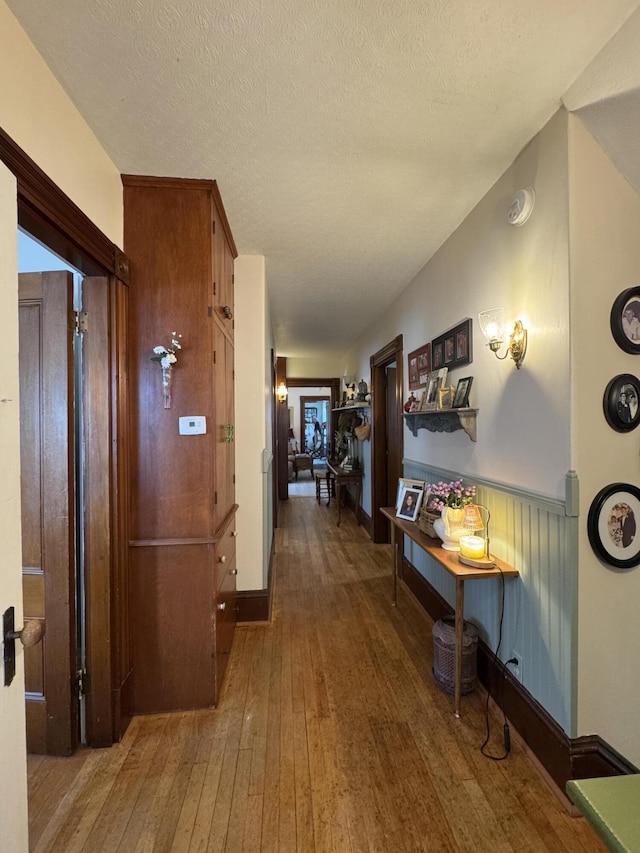 164 Lancey St, Pittsfield, ME 04967 - hall featuring hardwood / wood-style floors and a textured ceiling
