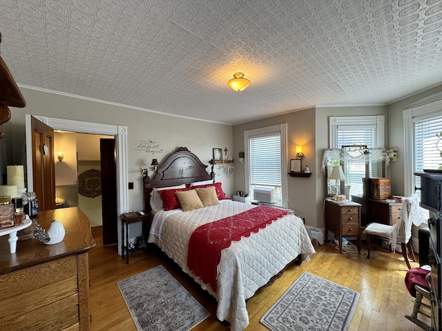 164 Lancey St, Pittsfield, ME 04967 - bedroom featuring crown molding, wood-type flooring, and an ornate ceiling