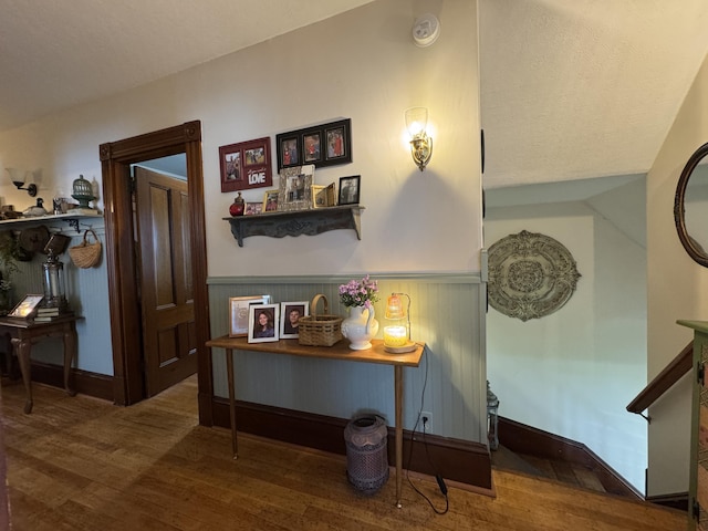 164 Lancey St, Pittsfield, ME 04967 - hallway with wood finished floors and a wainscoted wall