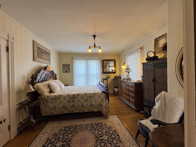 164 Lancey St, Pittsfield, ME 04967 - bedroom with ornamental molding, wood finished floors, wallpapered walls, and a chandelier