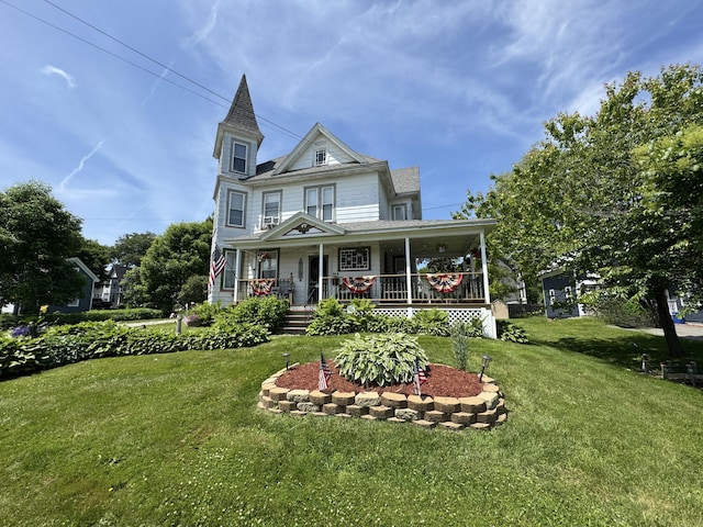 164 Lancey St, Pittsfield, ME 04967 - victorian home with a porch and a front yard