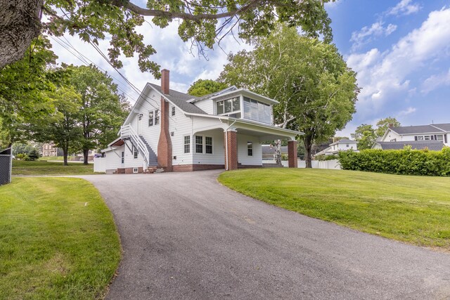3 Dion St, Lewiston, ME 04240 - view of front of property featuring a chimney and asphalt driveway