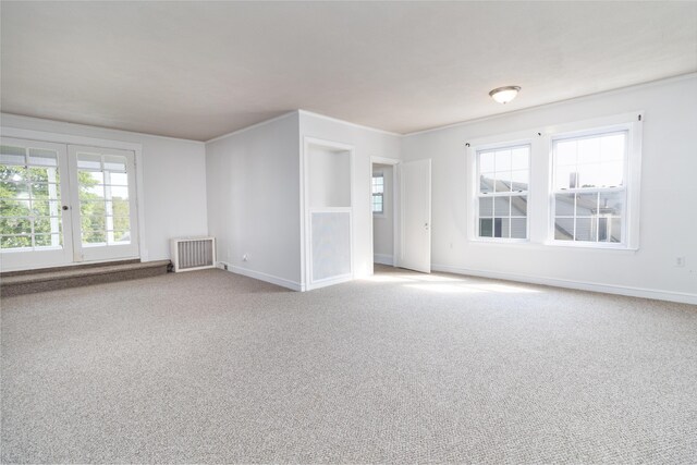 3 Dion St, Lewiston, ME 04240 - unfurnished living room with radiator and carpet flooring