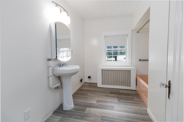 3 Dion St, Lewiston, ME 04240 - full bath featuring radiator, a bathtub, wood finished floors, and crown molding