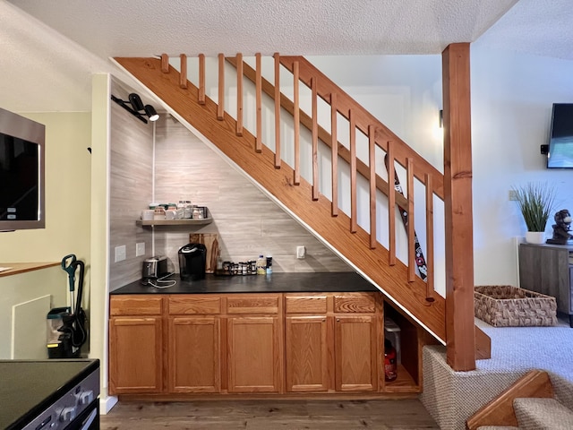 8 Fall Line Dr Unit N211, Newry, ME 04261 - indoor bar with light wood-type flooring, a textured ceiling, and stairway