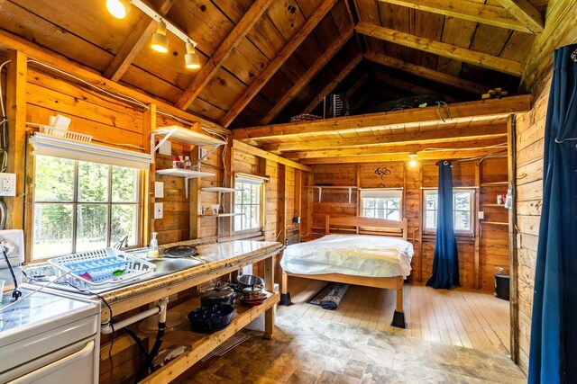 21 Jung Rd, East Machias, ME 04630 - bedroom with wooden walls, wood ceiling, light wood finished floors, and multiple windows