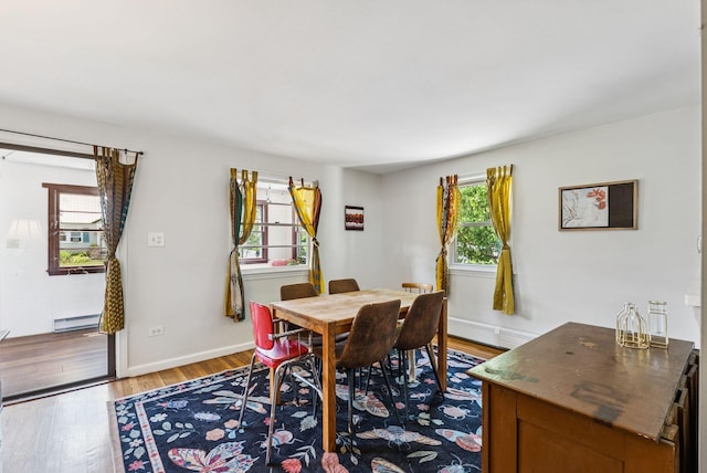 80 Merrymeeting Rd, Brunswick, ME 04011 - dining area with baseboard heating, light wood-style flooring, and a baseboard heating unit