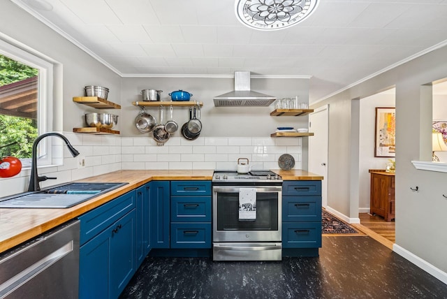 80 Merrymeeting Rd, Brunswick, ME 04011 - kitchen featuring wood counters, stainless steel appliances, wall chimney exhaust hood, open shelves, and blue cabinetry
