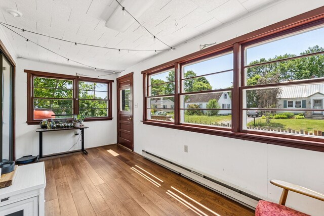 80 Merrymeeting Rd, Brunswick, ME 04011 - sunroom / solarium featuring baseboard heating and rail lighting