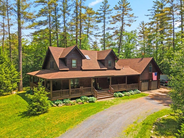 32 Lake Como Dr, Harmony, ME 04942 - log home with a porch, dirt driveway, a front lawn, roof with shingles, and an attached garage
