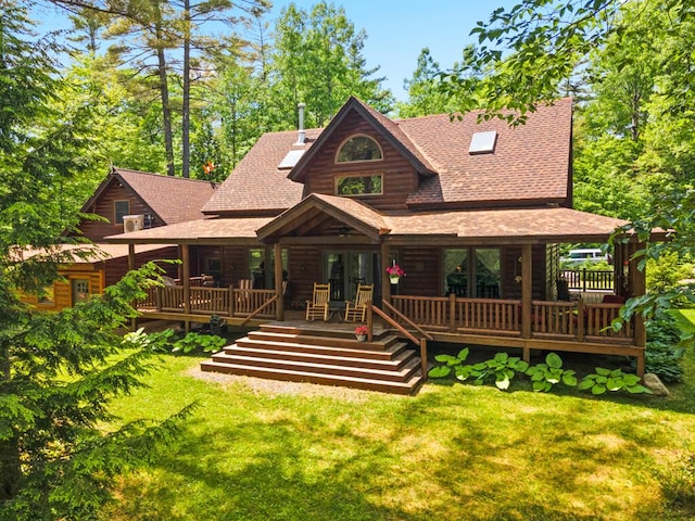 32 Lake Como Dr, Harmony, ME 04942 - view of front of home featuring a shingled roof, a front yard, and a deck