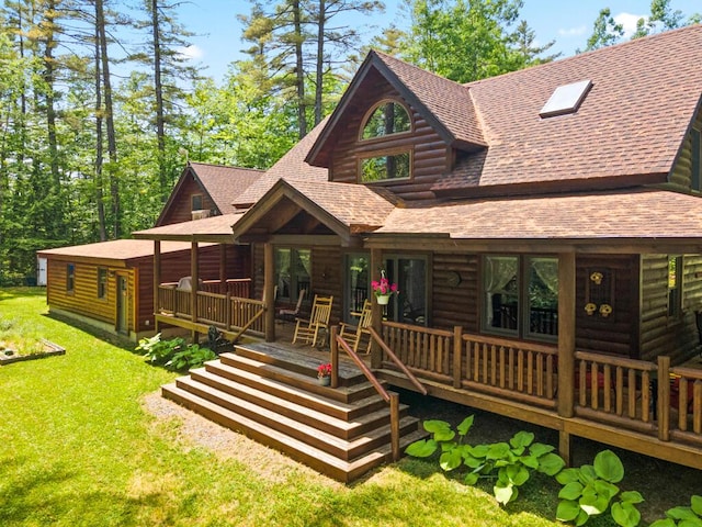 32 Lake Como Dr, Harmony, ME 04942 - log-style house with a shingled roof, a front lawn, and a wooden deck
