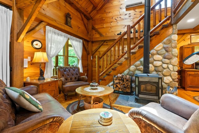32 Lake Como Dr, Harmony, ME 04942 - living area featuring wood walls, wood finished floors, wood ceiling, stairway, and a wall unit AC