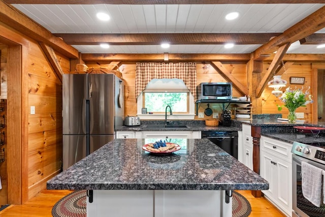 32 Lake Como Dr, Harmony, ME 04942 - kitchen with appliances with stainless steel finishes, light wood-type flooring, white cabinetry, recessed lighting, and a wood ceiling with exposed beams