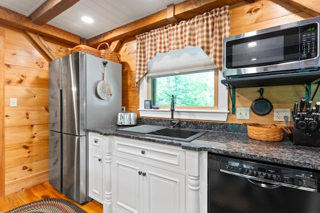 32 Lake Como Dr, Harmony, ME 04942 - kitchen featuring stainless steel appliances, white cabinets, light wood finished floors, beam ceiling, and dark stone counters