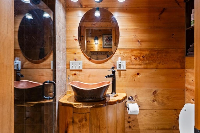 32 Lake Como Dr, Harmony, ME 04942 - bathroom with wood walls, vanity, and a stall shower
