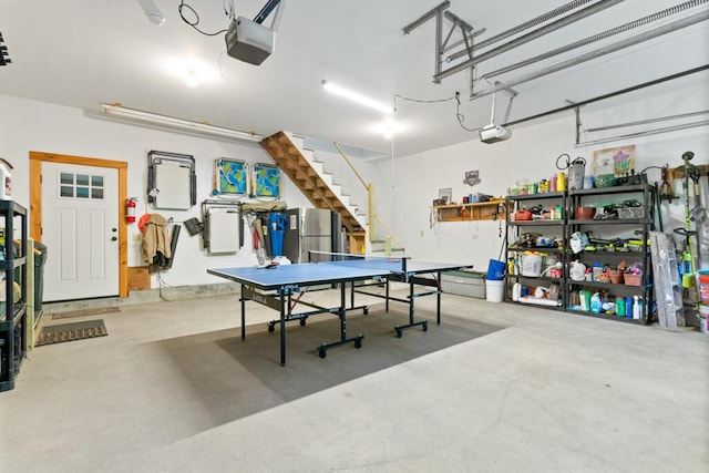 32 Lake Como Dr, Harmony, ME 04942 - garage with a garage door opener and freestanding refrigerator