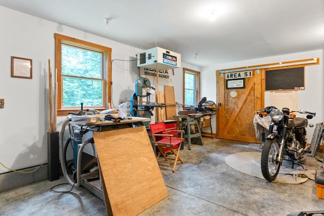 32 Lake Como Dr, Harmony, ME 04942 - miscellaneous room with concrete floors and a workshop area