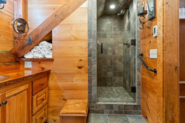 32 Lake Como Dr, Harmony, ME 04942 - bathroom featuring a shower stall, vanity, and wooden walls