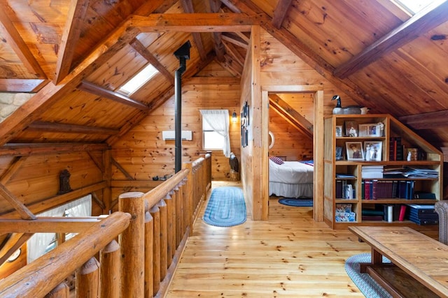 32 Lake Como Dr, Harmony, ME 04942 - unfurnished bedroom featuring wood ceiling, wooden walls, and hardwood / wood-style floors