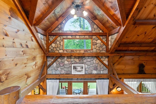 32 Lake Como Dr, Harmony, ME 04942 - detailed view of a wood ceiling with exposed beams, wood walls, and ceiling fan