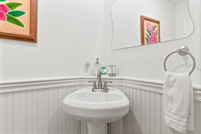 32 Lake Como Dr, Harmony, ME 04942 - bathroom with wainscoting and a sink