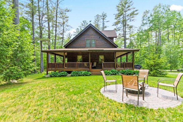 32 Lake Como Dr, Harmony, ME 04942 - back of property featuring a yard, a patio, and covered porch