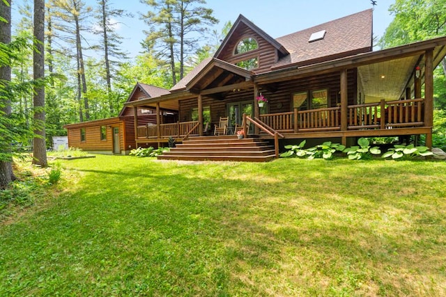 32 Lake Como Dr, Harmony, ME 04942 - back of property with a lawn, a shingled roof, a deck, and french doors