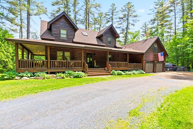 32 Lake Como Dr, Harmony, ME 04942 - log home featuring covered porch, a garage, driveway, and a shingled roof