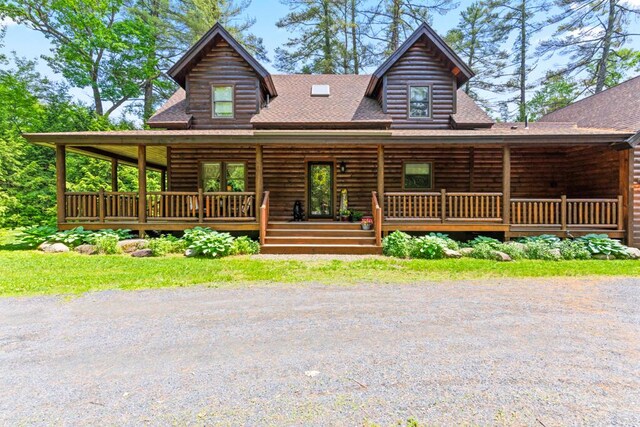 32 Lake Como Dr, Harmony, ME 04942 - log cabin with roof with shingles, a porch, and log exterior