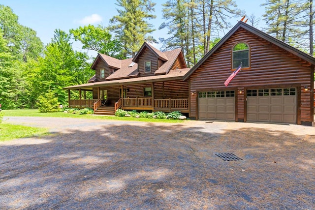 32 Lake Como Dr, Harmony, ME 04942 - log home featuring a porch, asphalt driveway, and a shingled roof