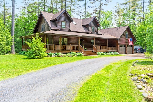 32 Lake Como Dr, Harmony, ME 04942 - log home with covered porch, a garage, a front yard, driveway, and roof with shingles