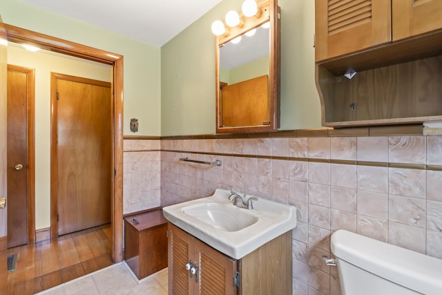 2 Wanda Ln, Gray, ME 04039 - bathroom featuring vanity, tile walls, and a wainscoted wall