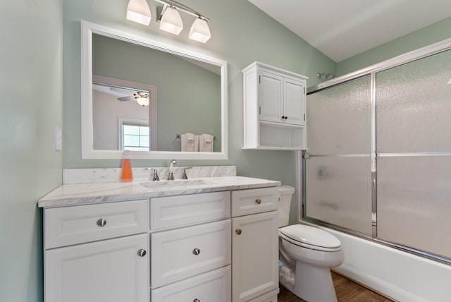 8 Studley Ln, Wells, ME 04090 - full bath featuring vanity, combined bath / shower with glass door, wood finished floors, and a ceiling fan